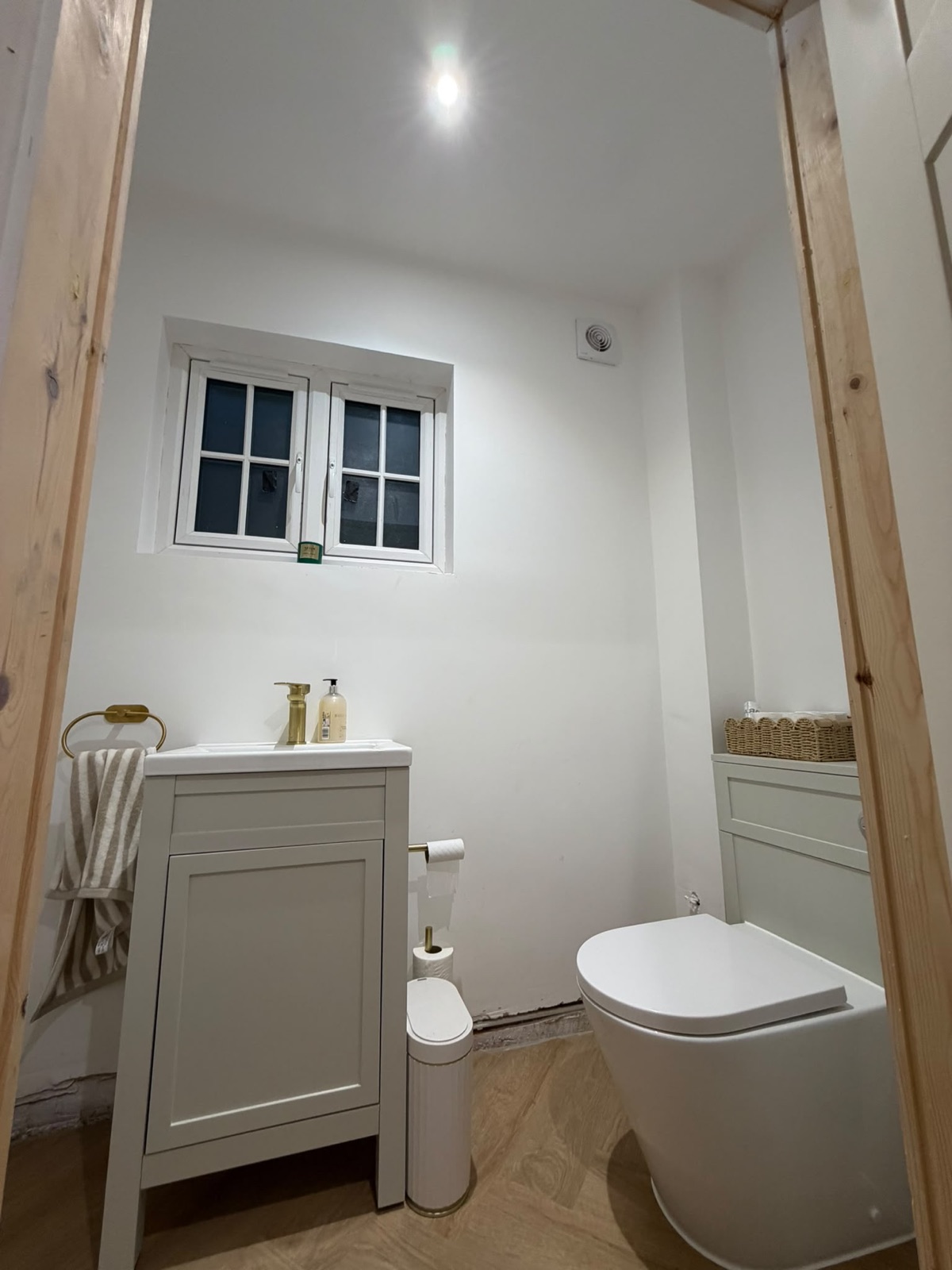 Family bathroom with vanity, downlight and window