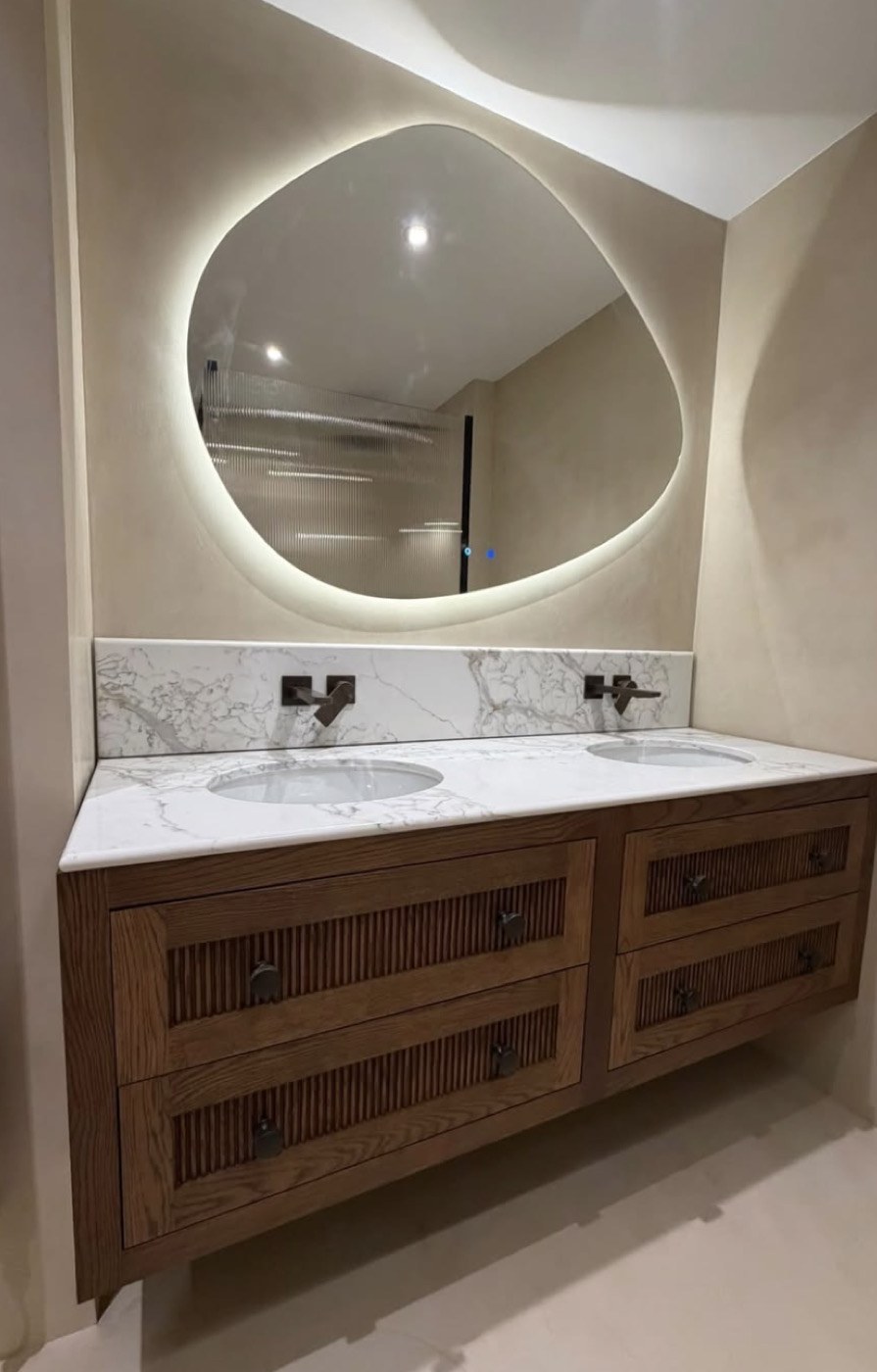 Backlit mirror and vanity lighting in a bathroom
