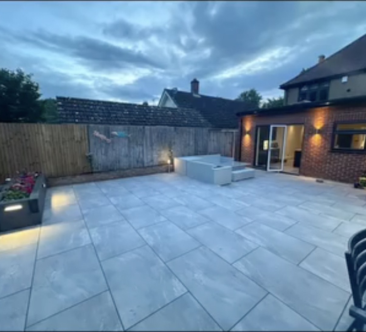 Patio and exterior wall lighting at dusk